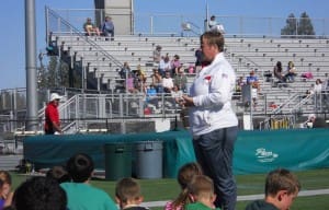 US OLYMPIAN PAULA BERRY ADDRESSING THE CROWD AT THE OLYMPIC DAY CELEBRATION.