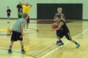 A CAMP MEMBER DRIVES TO THE HOOP