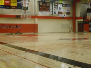 THE NEW GYM FLOOR AT MOUNTAIN VIEW HIGH SCHOOL RECEIVED A FRESH COAT OF PAINT.