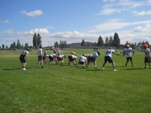 BRANSEN REYNOLDS AND THE SUMMIT STORM GET READY TO RUN ANOTHER PLAY AT PRACTICE