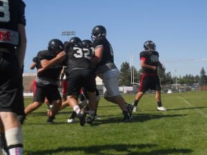 COUGARS COLLIDE AT PRACTICE.