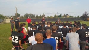 COACH CRUM TALKS TO THE TEAM AFTER PRACTICE