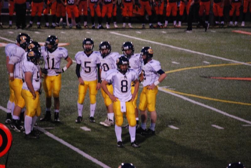 Bend QB Beau Walker gets a call from the sidelines.